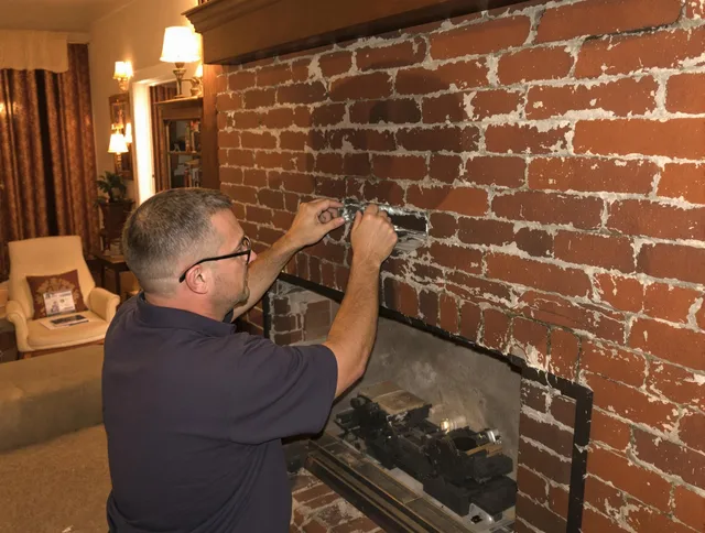 Black Forest Chimney Sweep expert fixing a fireplace in Black Forest, CO